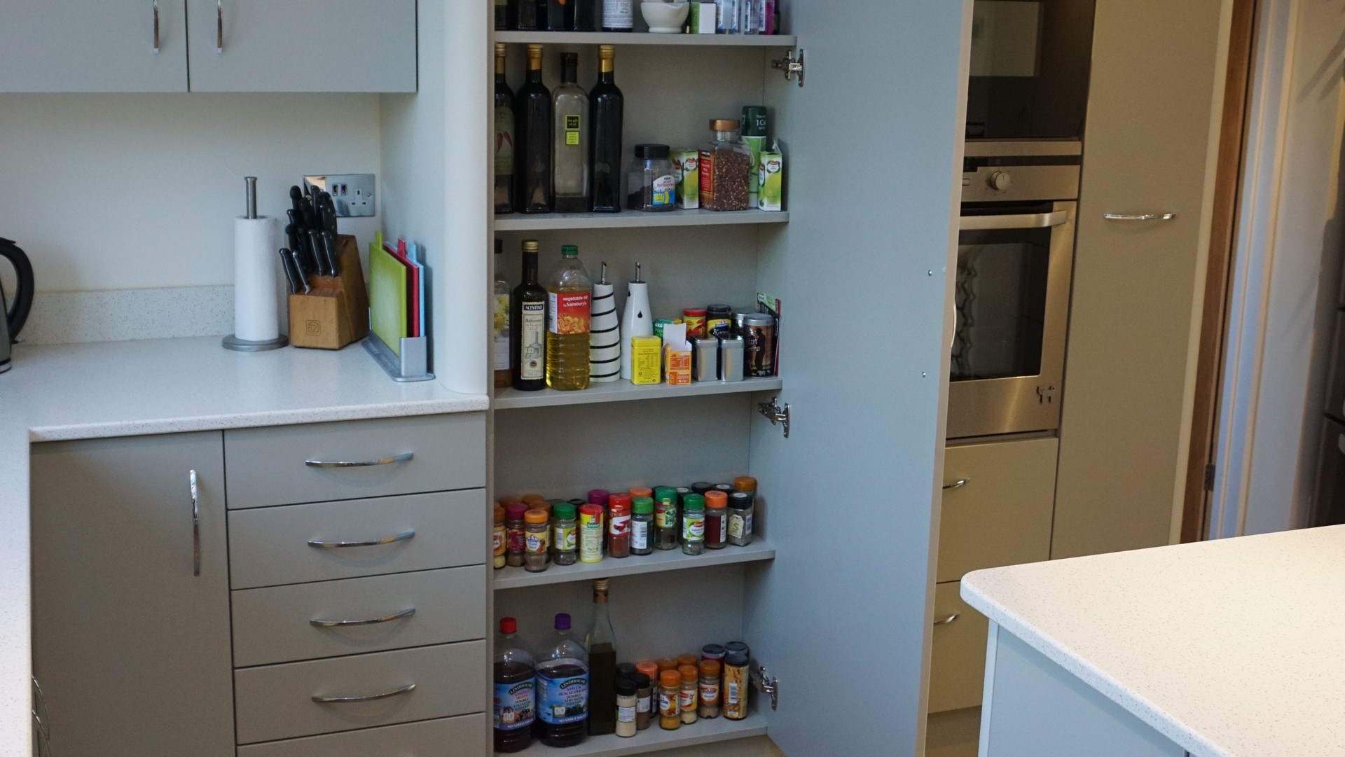 Completed works - Reduced depth tower cabinet with shelves for bottles, herbs and spices