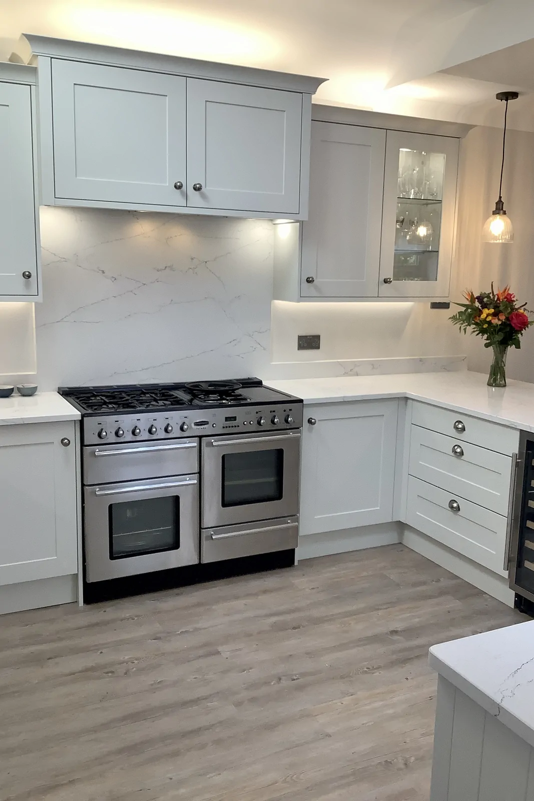Highland Grey painted shaker kitchen with Rangemaster range and quartz backsplash by Redwood Kitchens in Blackwater