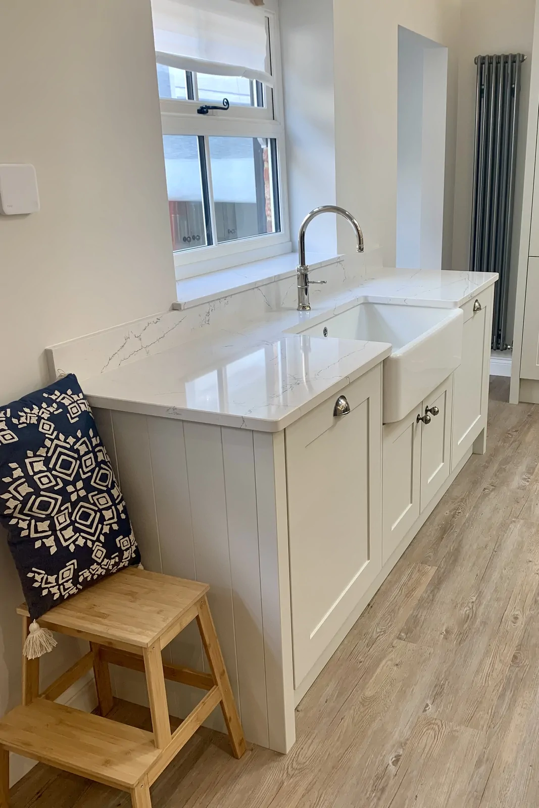 Painted shaker kitchen in Highland Grey with butler sink and Quooker tap by Redwood Kitchens Blackwater