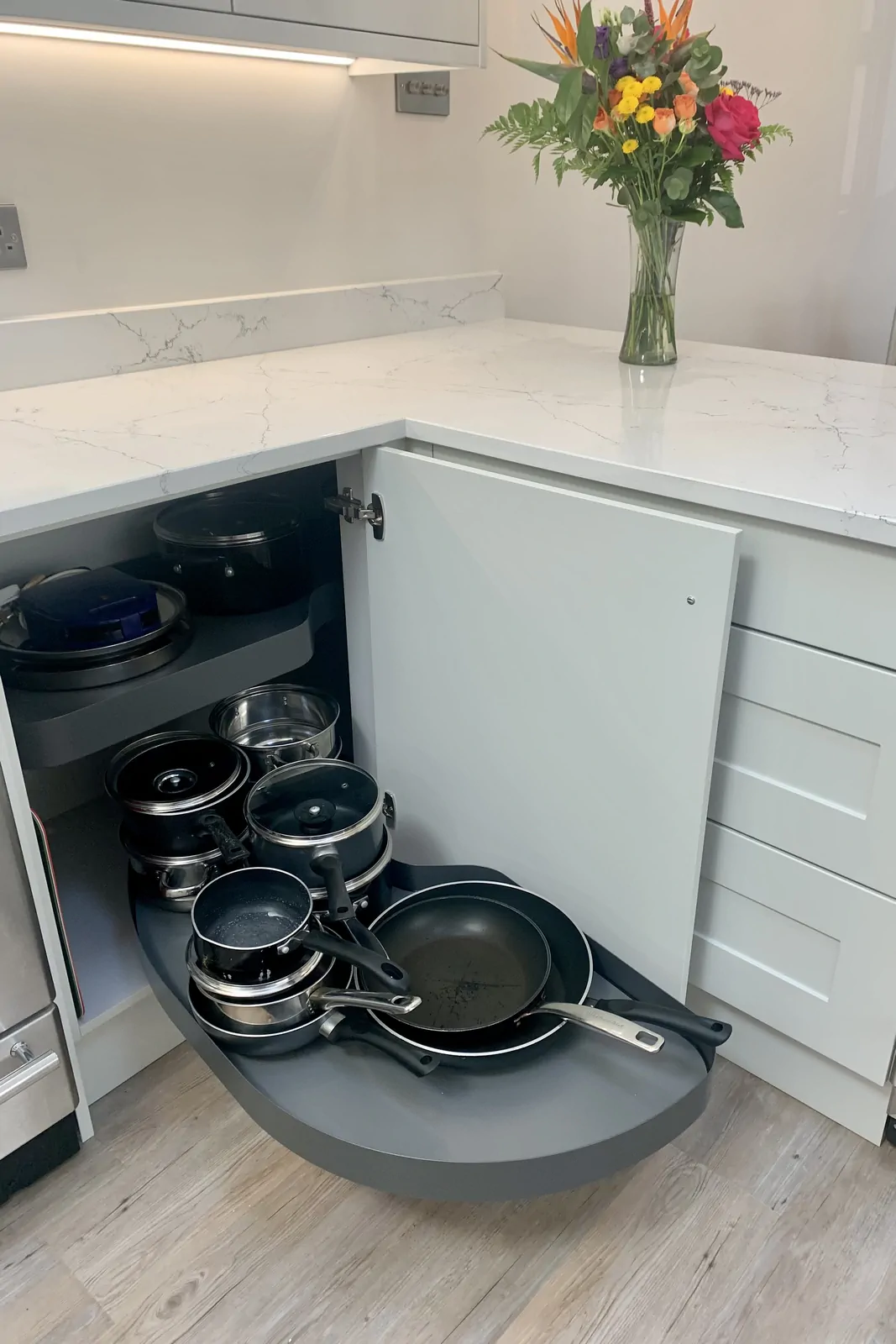 Highland Grey kitchen corner unit with Vauth Sagel LeMans style trays installed by Redwood Kitchens
